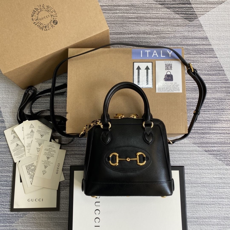 G*u*i top handle bags